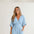 tessie-elegant-wrap-jumpsuit-with-wide-leg-and-pockets-light-blue